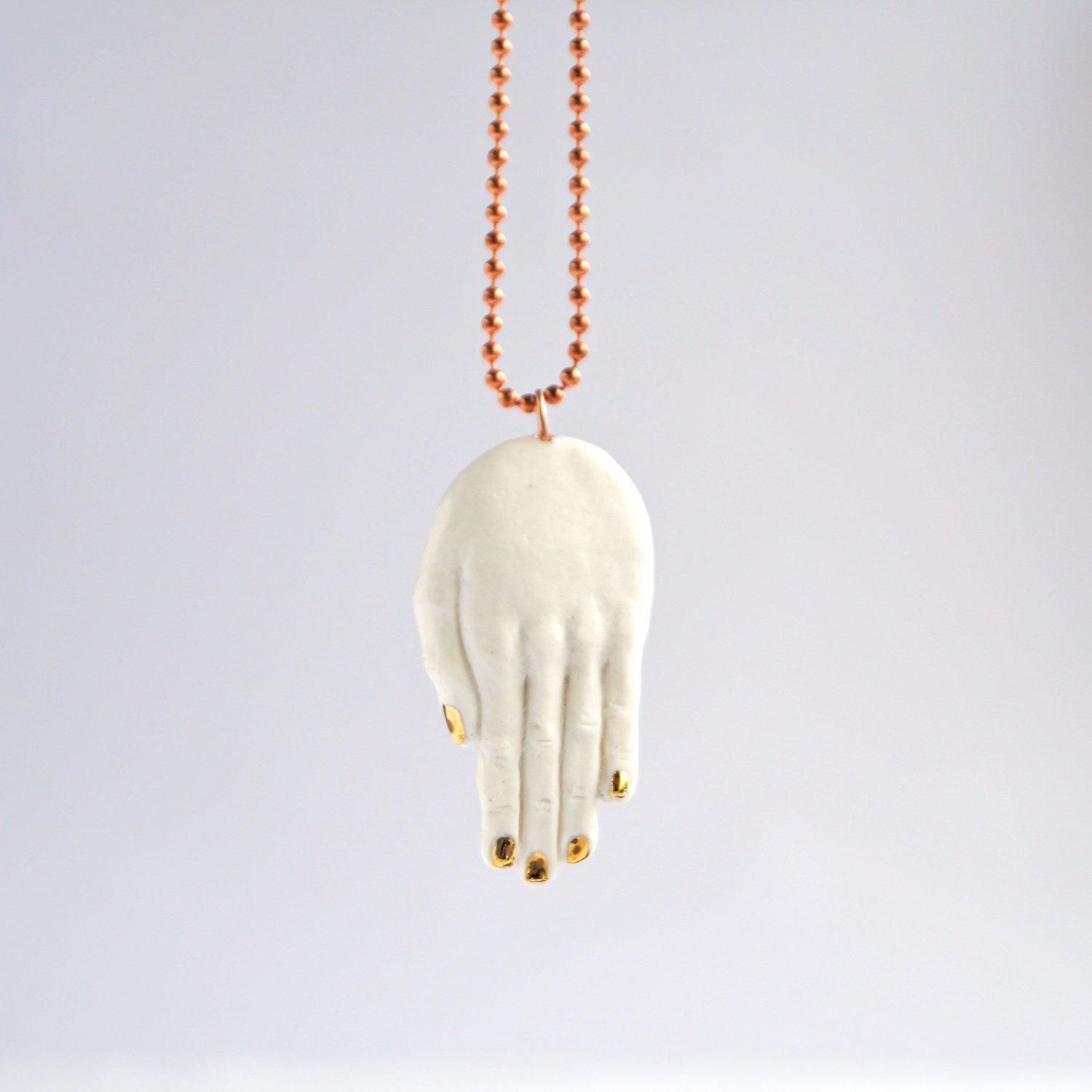 Sculpted hand necklace, porcelain hand necklace, gold lustre, copper chain, 7th anniversary, 22nd anniversary, 18th anniversa