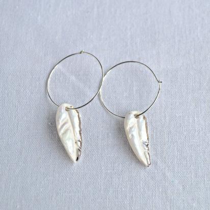 White feather and silver hoop earrings